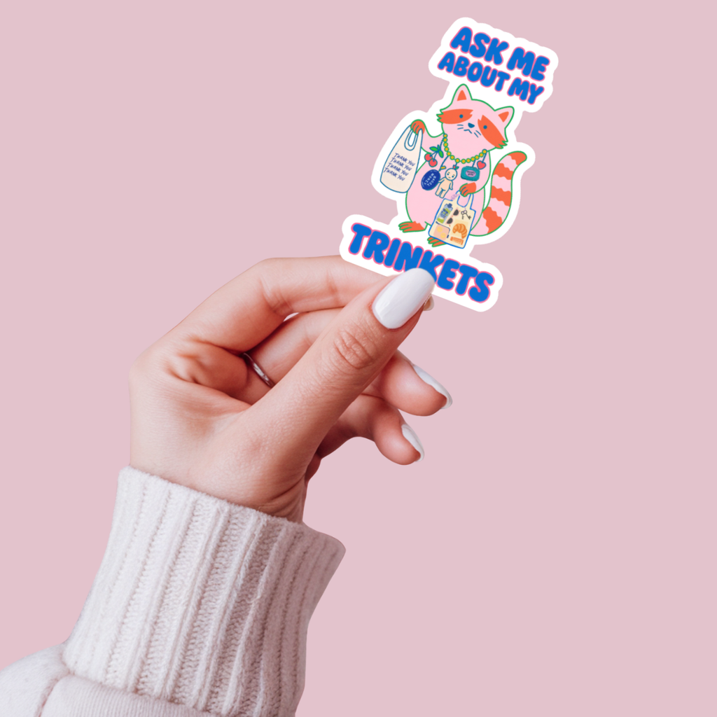 Ask Me About My Trinkets Sticker –Quirky Raccoon Collectible